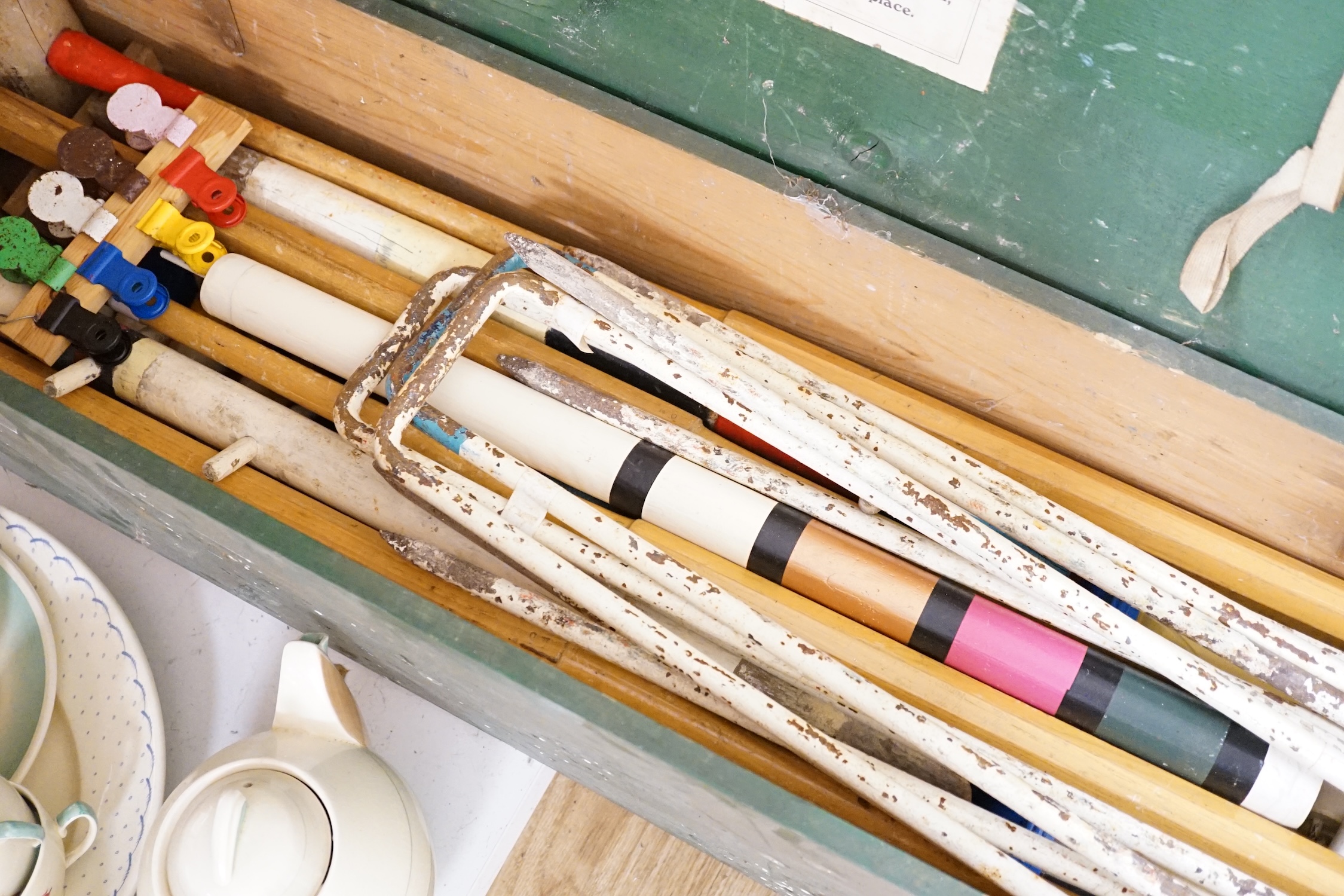 An early 20th century boxed croquet set